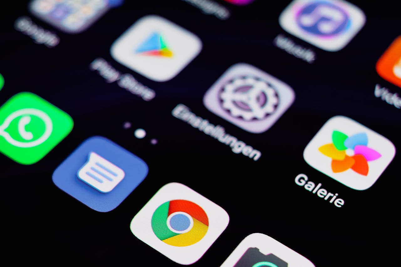 The Art of Drawing Readers In: Your attractive post title goes here Close-up image of a smartphone screen displaying various app icons on a dark background.